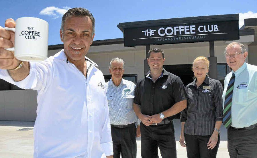 One of The Coffee Club directors John Lazarou, Landmark Harcourts principal Max Holder, franchisees Peter and Lyndall Cook and Landmark Harcourts real estate agent Peter Thew outside the doors of the new Coffee Club. One of The Coffee Club directors John Lazarou, Landmark Harcourts principal Max Holder, franchisees Peter and Lyndall Cook and Landmark Harcourts real estate agent Peter Thew outside the doors of the new Coffee Club.
